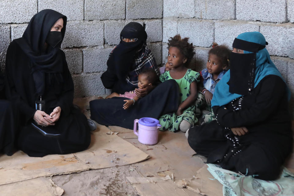 ADEN, YEMEN - MARCH 06: In this handout photo issued by the United Nations High Commission for Refugees, Special envoy Angelina Jolie meets displaced Yemeni people, who fled their homes during the war, at a makeshift camp on March 6, 2022 in Aden, Lahej, Yemen. (Photo by Marwan Tahtah/UNHCR via Getty Images)