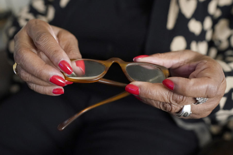 Lee Cole, 74, who is blind, shows the reading glasses with a thick magnifying lens on the right eye that she uses with limited sight since she is completely blind in her left eye, Friday, March 24, 2023, at her Jackson, Miss., apartment. Disjointed coordination between election authorities and disability advocates has been a persistent problem in Mississippi, especially related to reliable transportation. It was the reason Cole, missed a local election in Jackson in January. That frustrated Cole, because she said she tries to vote in every election. (AP Photo/Rogelio V. Solis)