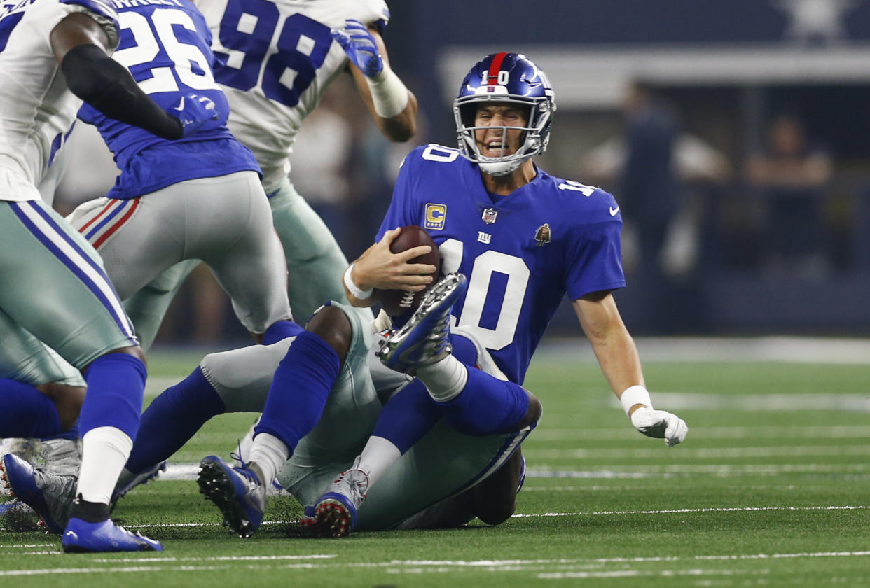 Eli Manning gets sacked by the Cowboys' Demarcus Lawrence. (Photo: Fort Worth Star-Telegram via Getty Images)