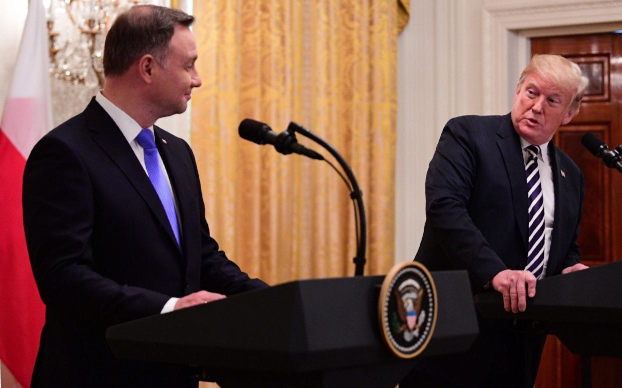 Donald Trump, the US president, right, and Andrzej Duda, the Polish president, left, during a press conference in the White House - AFP