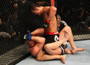 SAITAMA, JAPAN - FEBRUARY 26: (R-L) Yushin Okami punches Tim Boetsch during the UFC 144 event at Saitama Super Arena on February 26, 2012 in Saitama, Japan.