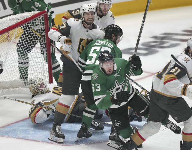 Dallas Stars' Evgenii Dadonov falls against Vegas Golden Knights' Mark Stone as Shea Theodore Brayden McNabb and goaltender Adin Hill defend the goal against Stars Wyatt Johnston (during the first period of Game 3 of the NHL hockey Stanley Cup Western Conference finals in Dallas, Tuesday, May 23, 2023. (AP Photo/LM Otero)
