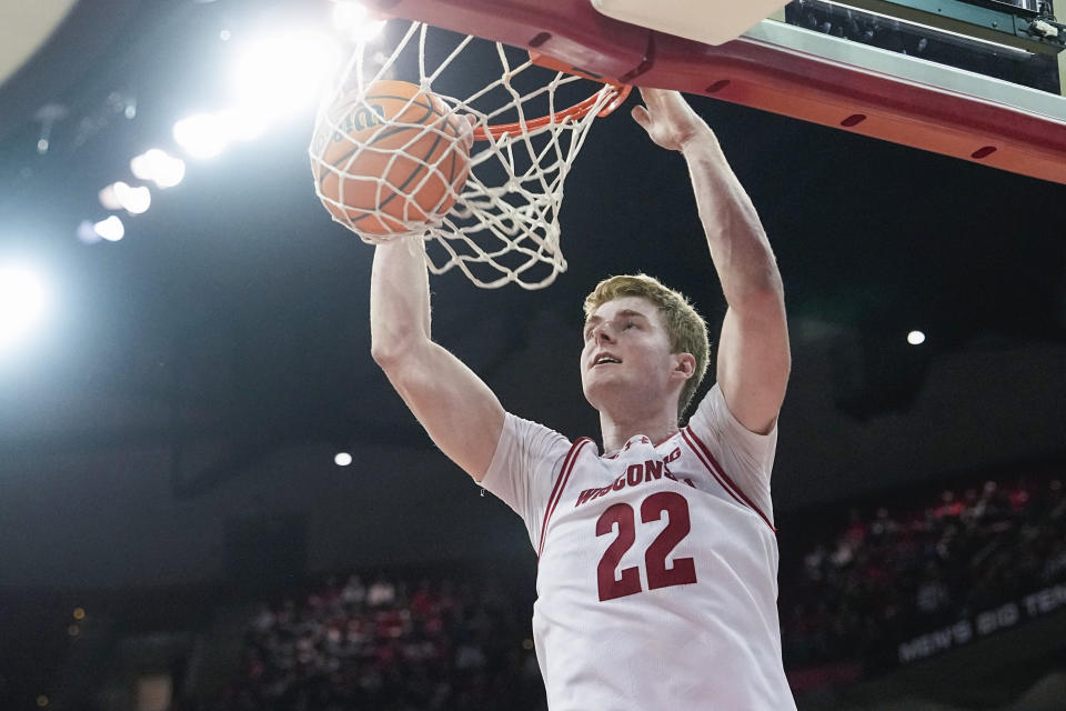 Wisconsin's Steven Crowl dunks against Rutgers during the second half of an NCAA college basketball game Thursday, March 7, 2024, in Madison, Wis. (AP Photo/Andy Manis)