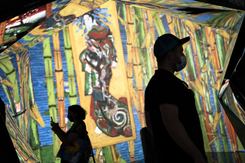 Projections of selected works of celebrated painter Vincent Van Gogh are displayed at a preview of the Immersive Van Gogh exhibit at Pier 36, Friday, June 4, 2021, in New York. (AP Photo/John Minchillo)