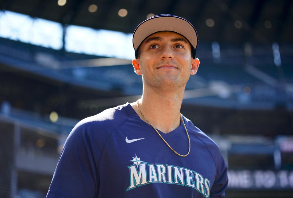 Seattle Mariners' Dominic Canzone walks out onto the field during batting practice before a baseball game against the Boston Red Sox, Tuesday, Aug. 1, 2023, in Seattle. (AP Photo/Lindsey Wasson)