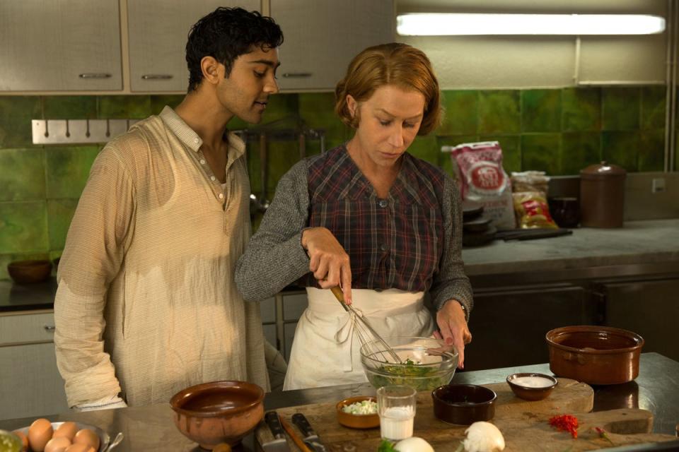 Manish Dayal (left) as Hassan Haji and Helen Mirren as Madame Mallory in The Hundred-Foot Journey (2014) (Amblin/Dreamworks/Harpo/Imagination/Kobal/Shutterstock)