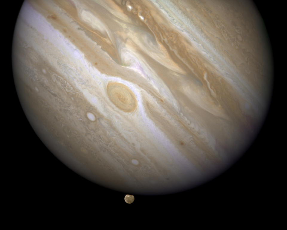 The planet Jupiter is shown with one of its moons, Ganymede (bottom), in this NASA handout taken April 9, 2007 and obtained by Reuters March 12, 2015. Scientists using the Hubble Space Telescope have confirmed that the Jupiter-orbiting moon Ganymede has an ocean beneath its icy surface, raising the prospects for life, NASA said on Thursday.  REUTERS/NASA/ESA and E. Karkoschka/Handout via Reuters  (OUTERSPACE - Tags: SCIENCE TECHNOLOGY) ATTENTION EDITORS - THIS PICTURE WAS PROVIDED BY A THIRD PARTY. REUTERS IS UNABLE TO INDEPENDENTLY VERIFY THE AUTHENTICITY, CONTENT, LOCATION OR DATE OF THIS IMAGE. FOR EDITORIAL USE ONLY. NOT FOR SALE FOR MARKETING OR ADVERTISING CAMPAIGNS. THIS PICTURE IS DISTRIBUTED EXACTLY AS RECEIVED BY REUTERS, AS A SERVICE TO CLIENTS