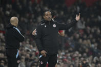 FILE - Reading manager Paul Ince gestures to his players during the English FA Cup 4th round soccer match between Manchester United and Reading at Old Trafford in Manchester, England, Saturday, Jan. 28, 2023. Racism has long permeated the world's most popular sport, with soccer players subjected to racist chants and taunts online. While governing bodies like FIFA and UEFA have taken steps to combat the abuse of players, the lack of diversity in the upper ranks at major clubs remains an unsolved problem. Ince began his managerial career with then-fourth division team Macclesfield. His only top flight job was with Blackburn in 2008. He was fired after less than six months and has not been hired by a Premier League club since. (AP Photo/Rui Vieira, File)