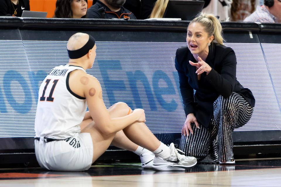Dec 30, 2023; Stillwater, Okla, USA ; Oklahoma State Cowgirls head coach Jacie Hoyt talks with guard Rylee Langerman (11) on the baseline in the first half of an NCAA womenÕs basketball game against the Iowa State Cyclones at Gallagher Iba arena. Mandatory Credit: Mitch Alcala-The Oklahoman