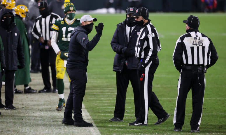 Green Bay Packers coach Matt LaFleur arguing with referees after a questionable pass interference call in the NFC Chapionship.
