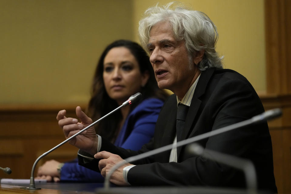 Pietro Orlandi, right, brother of Manuela, a 15-year-old daughter of a Vatican employee disappeared in 1983, is flanked by his lawyer Laura Sgro as he attends a press conference on the establishing of a parliamentary investigative commission on Manuela Orlandi and other cold cases in Rome, Tuesday, Dec. 20, 2022. (AP Photo/Alessandra Tarantino)