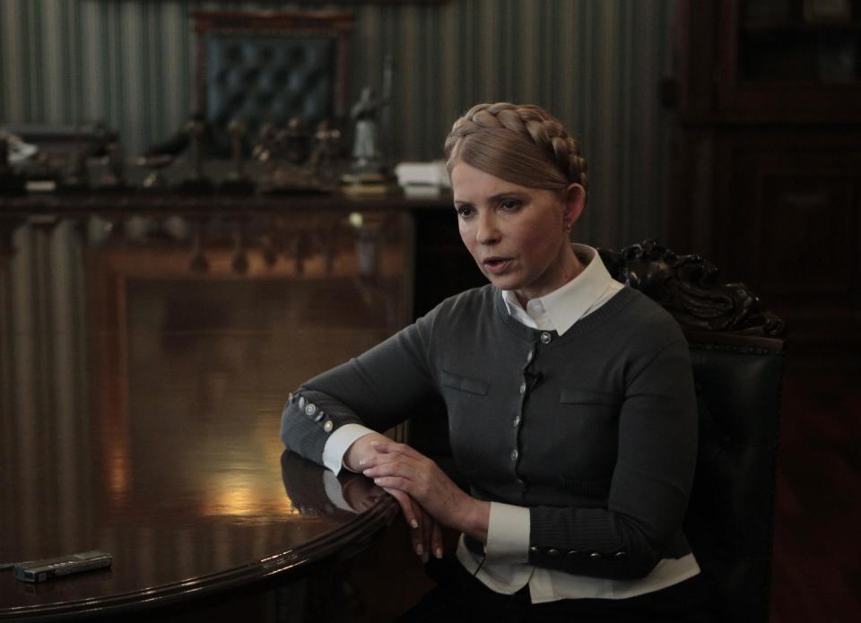 Former Ukrainian Prime Minister and candidate for the upcoming presidential elections Yulia Tymoshenko speaks during an interview with The Associated Press in Kiev, Ukraine, Saturday, April 26, 2014. Tymoshenko says Ukraine “must be a member of NATO” in order to protect itself from Russian aggression. While Tymoshenko has not previously backed NATO membership publicly, she and other Ukrainian politicians have ramped up the tough rhetoric as pro-Russia militias seized police stations and government buildings across eastern Ukraine. (AP Photo/Sergei Chuzavkov)