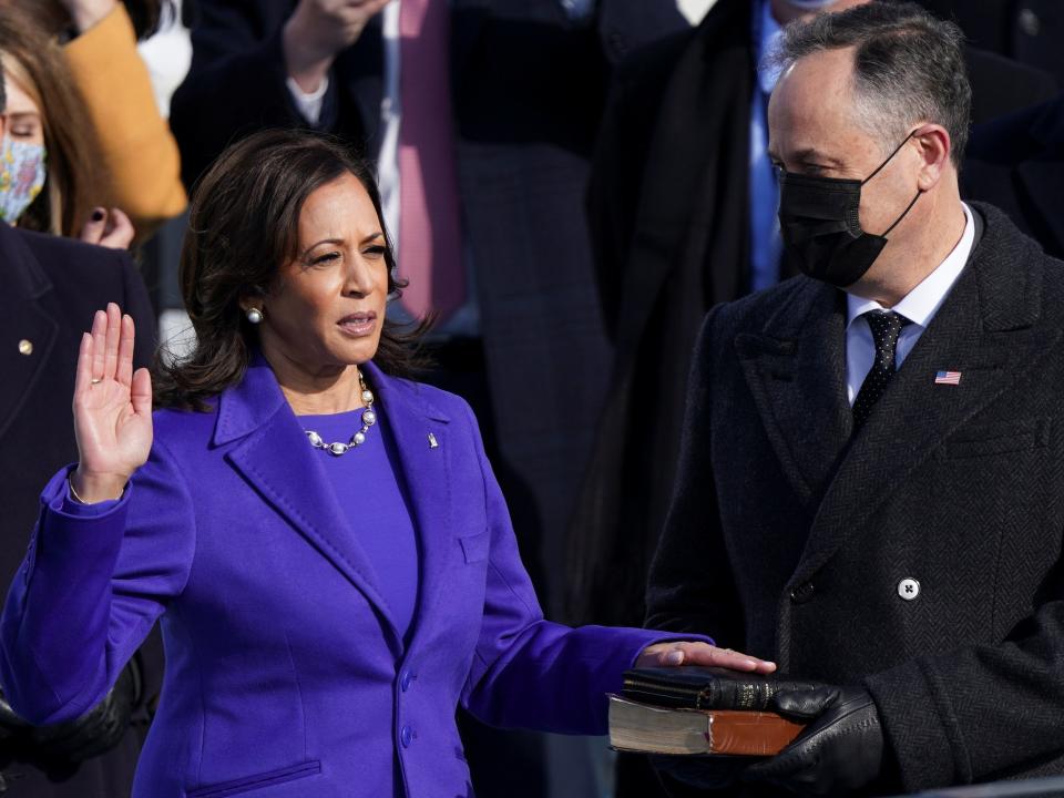 Kamala Harris is sworn in as vice president, becoming the first woman to hold the office in the nation’s history, as well as the first Black woman and first woman of South Asian descent to hold the title. Spouse Doug Emhoff holds the bible and also makes history in becoming the first-ever second gentlemanREUTERS