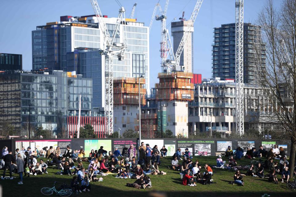 People take advantage of the good weather enjoying the winter sunshine in Hackney WickAFP via Getty Images