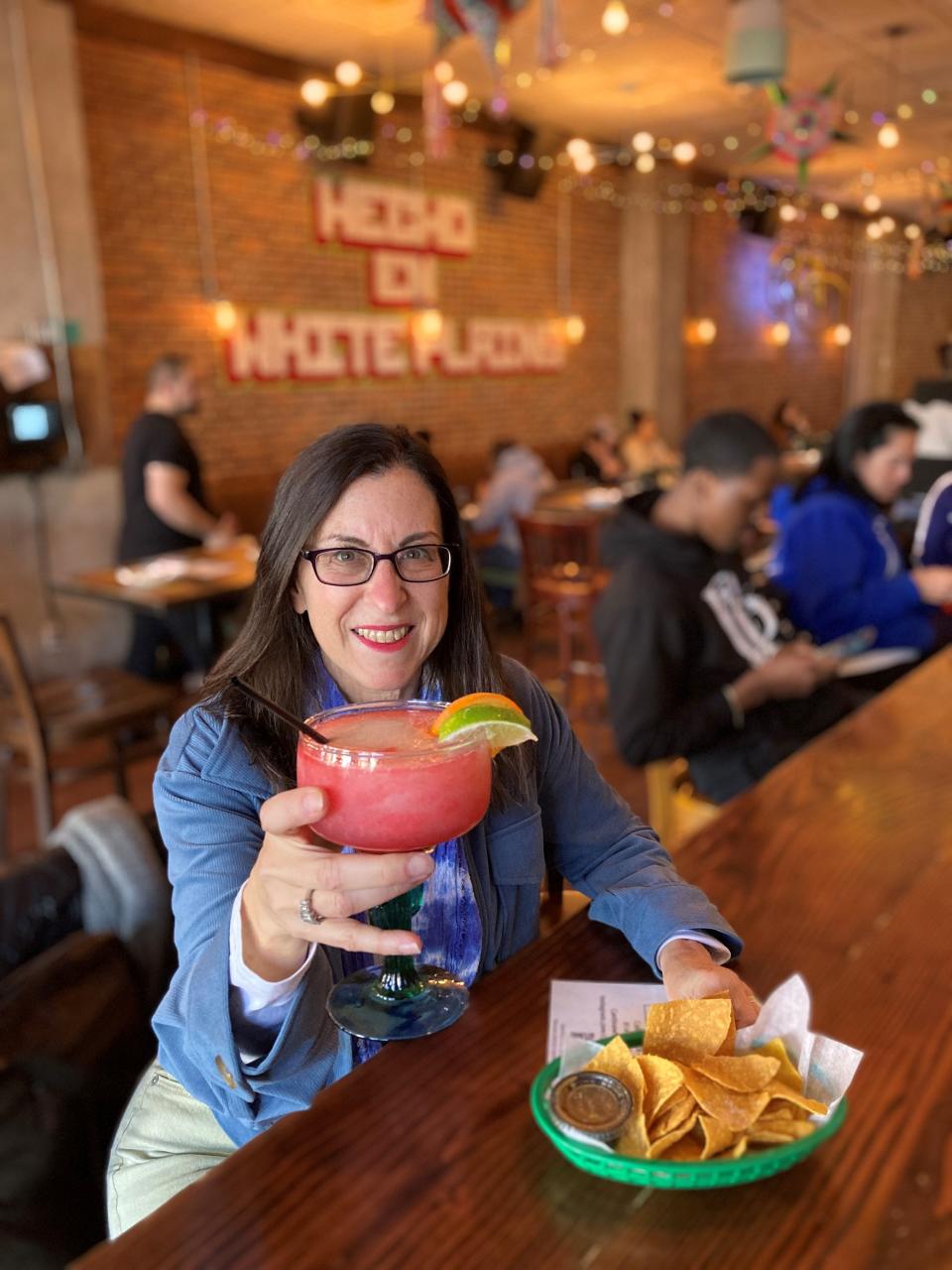 Lohud Food & Dining Reporter Jeanne Muchnick with a frozen strawberry margarita at Cantina Tacos & Tequila Bar in White Plains. Photographed April 28, 2022.