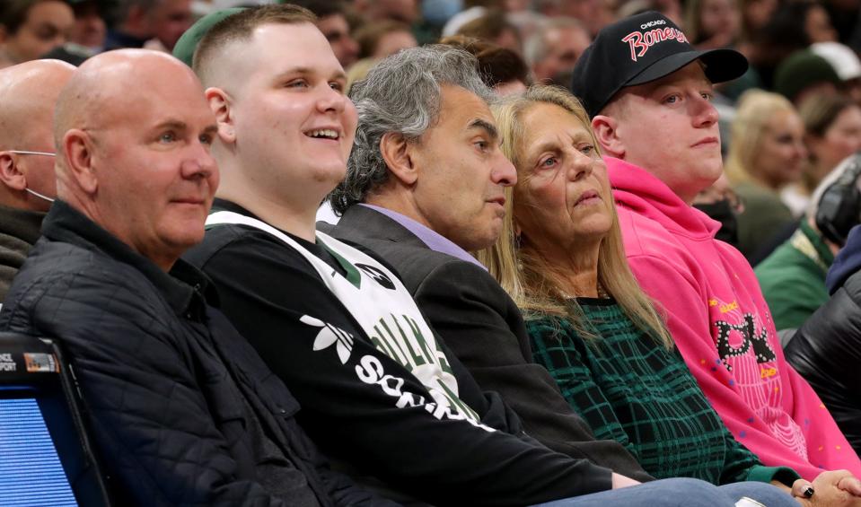 David Gruber (third from left) and his wife Nancy watch the Milwaukee Bucks plays the Charlotte Hornets on February 28, 2022, at Fiserv Forum in Milwaukee, Wis.