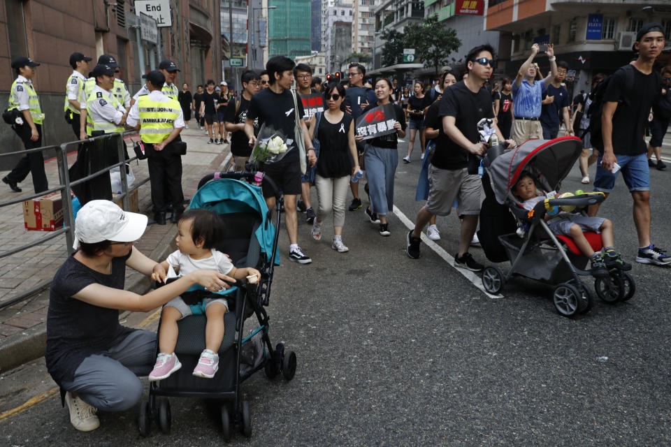 Protesters march on the streets against an extradition bill in Hong Kong on Sunday, June 16, 2019. Hong Kong residents Sunday continued their massive protest over an unpopular extradition bill that has highlighted the territory's apprehension about relations with mainland China, a week after the crisis brought as many as 1 million into the streets. (AP Photo/Vincent Yu)