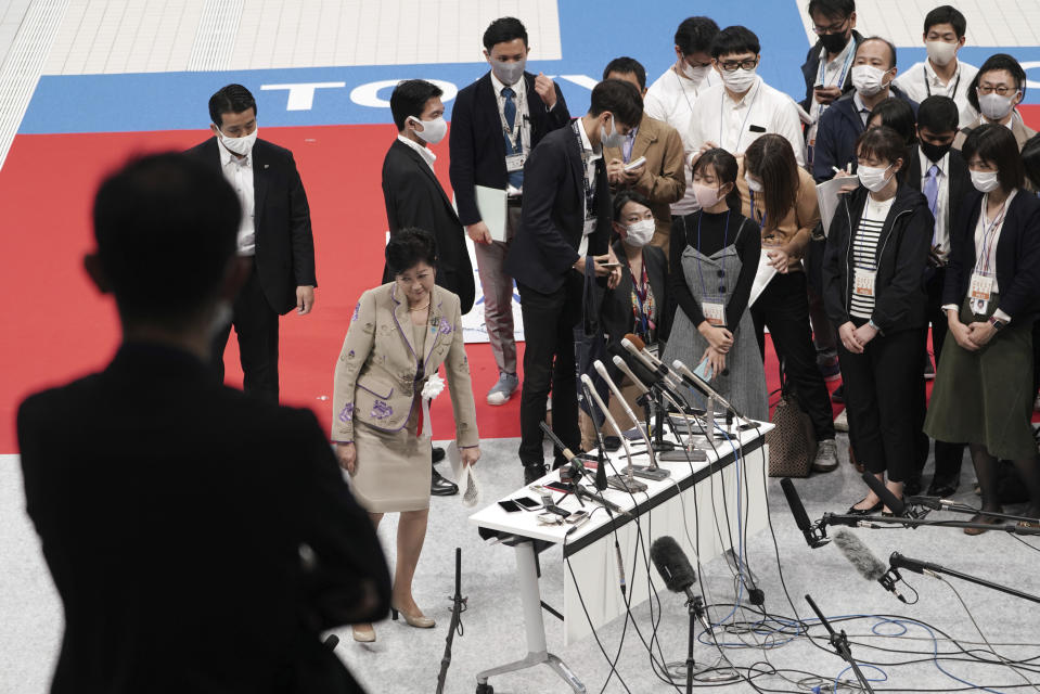 Tokyo Gov. Yuriko Koike speaks to media after a grand opening ceremony of Tokyo Aquatics Center Saturday, Oct. 24, 2020, in Tokyo. The Tokyo 2020 organizing committee held the grand opening ceremony Saturday at the aquatics center, planned to host Olympic artistic swimming, diving and swimming and Paralympics swimming events in 2021. (AP Photo/Eugene Hoshiko)