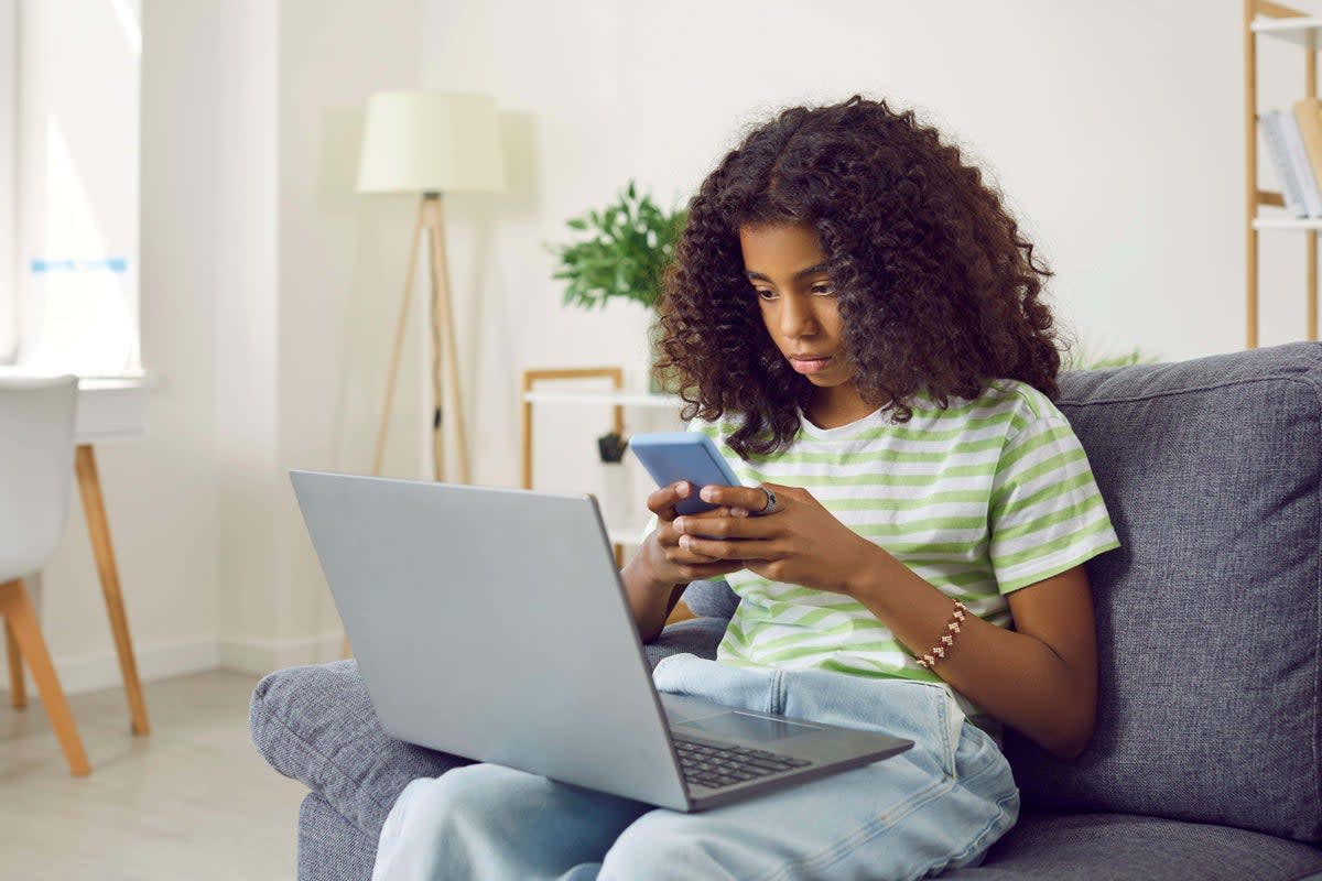 More girls said they felt addicted to social media than boys (Alamy/PA)