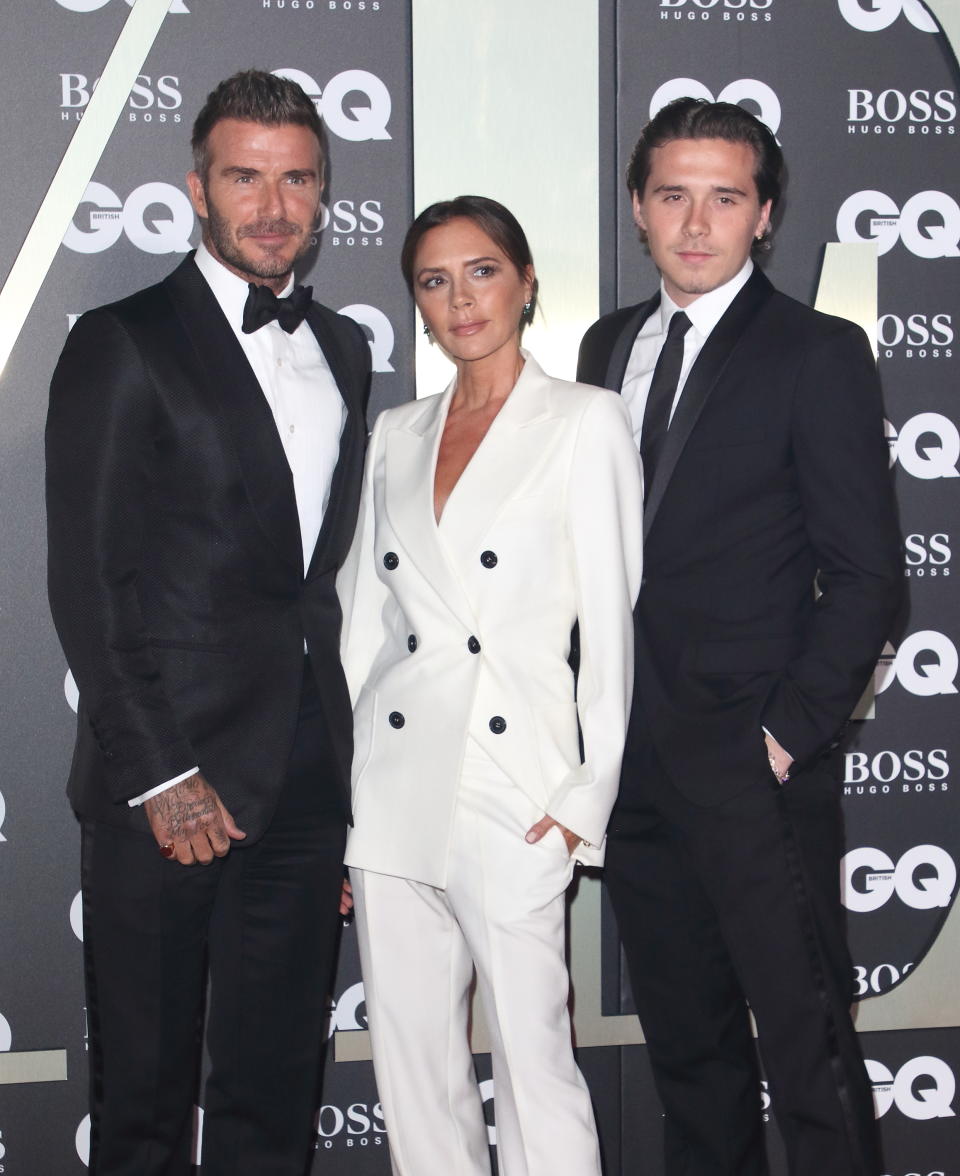 David Beckham, Victoria Beckham and Brooklyn Beckham attend the GQ Men of the Year Awards held at the Tate Modern, Bankside in London. (Photo by Keith Mayhew / SOPA Images/Sipa USA)