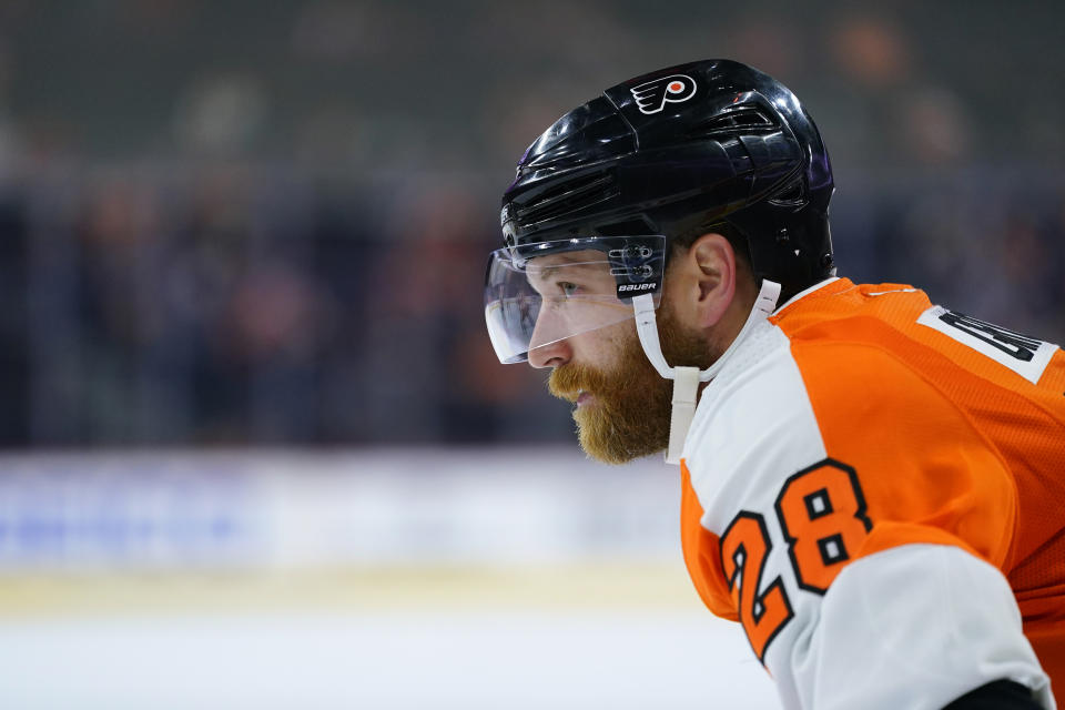 Philadelphia Flyers' Claude Giroux stands before a face-off during the second period of a preseason NHL hockey game against the New York Islanders, Tuesday, Sept. 28, 2021, in Philadelphia. (AP Photo/Matt Slocum)