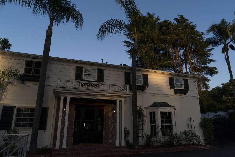 A mansion purchased by the Black Lives Matter Global Network Foundation is illuminated by the setting sun before a welcome dinner for the annual Families United 4 Justice Network Conference, hosted by the foundation in the Studio City neighborhood of Los Angeles, Thursday, Sept. 28, 2023. The national Black Lives Matter nonprofit that was widely criticized for purchasing a sprawling California mansion with donated funds recently opened the property to dozens of families who lost loved ones in incidents of police violence. (AP Photo/Jae C. Hong)