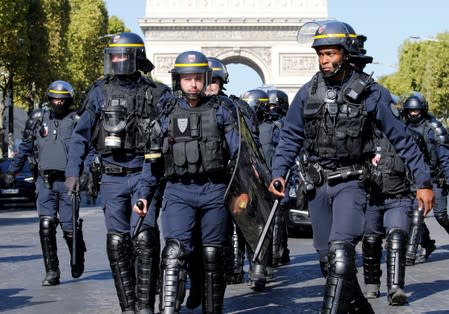 Protesters attend a demonstration on Act 45 (the 45th consecutive national protest on Saturday) of the yellow vests movement in Paris