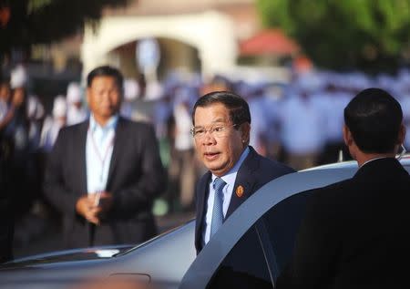 FILE PHOTO: Cambodia's Prime Minister Hun Sen, who is also president of the ruling Cambodian People's Party (CPP), arrives before a ceremony to mark the 66th anniversary of the establishment of the party, at Koh Pich island in Phnom Penh, Cambodia, June 28, 2017. REUTERS/Samrang Pring