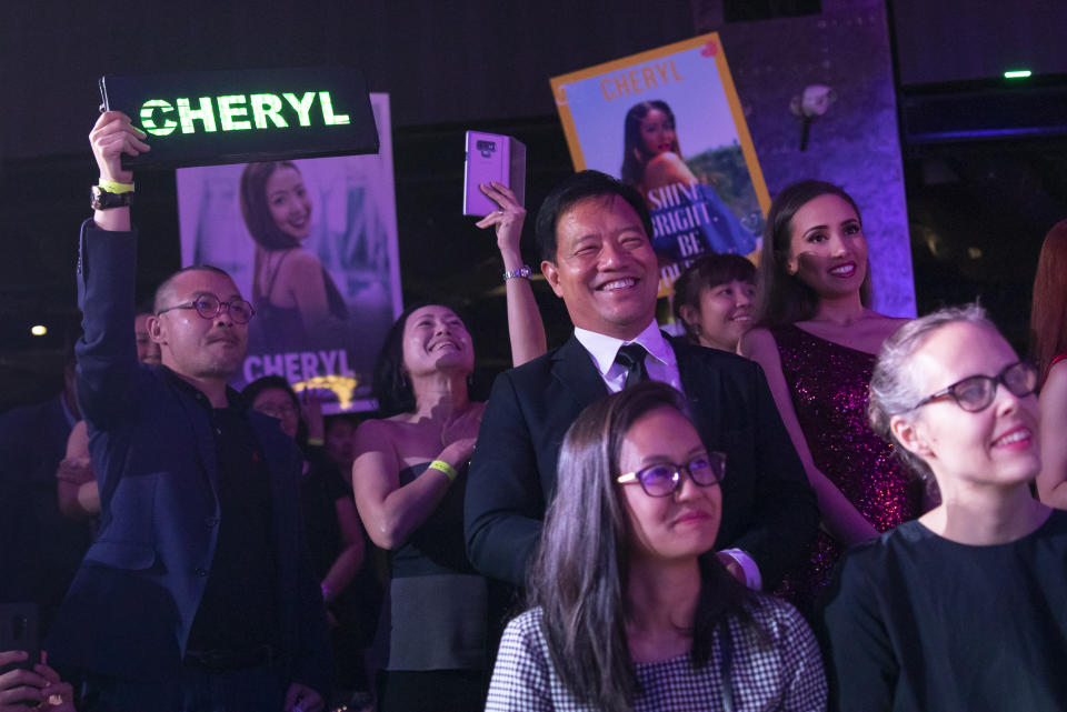 Supporters of Cheryl Yao cheer during the finals of the 2019 Miss Universe Singapore beauty pageant at Zouk.