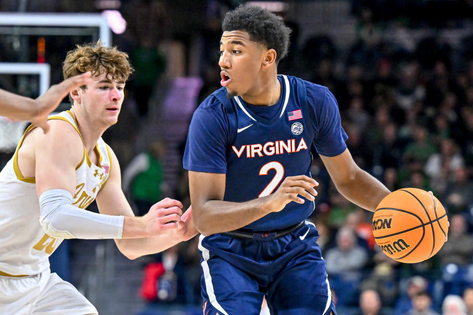 Dec 30, 2023; South Bend, Indiana, USA; Virginia Cavaliers guard Reece Beekman (2) dribbles as Notre Dame Fighting Irish guard J.R. Konieczny (20) defends in the second half at the Purcell Pavilion. Matt Cashore-USA TODAY Sports