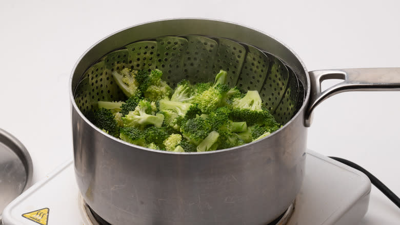 broccoli florets being steamed