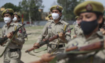 Special police officer recruits who completed nearly three months physical training demonstrate their skills at Kathua in Indian-controlled Kashmir, Saturday, June 5, 2021. Special police officers are lower-ranked police officials who are mainly recruited for intelligence gathering and counterinsurgency operations. In recent years, the force has assisted in border areas as well because of local recruits' familiarity with the topography and ability to assist police and border guards during emergencies. (AP Photo/Channi Anand)