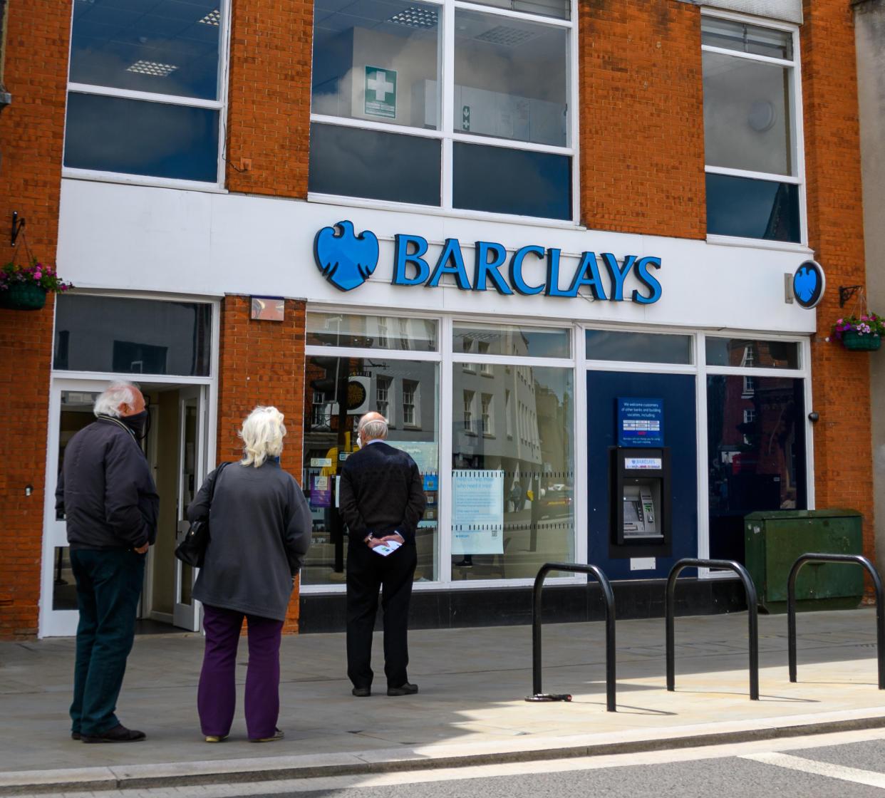 Wokingham, United Kingdom - June 05 2020:  Shoppers queuing outside the branch of Barclays Bank on Peach St