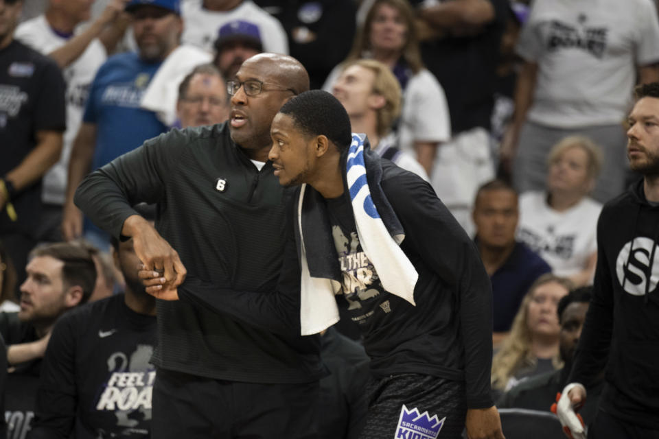Sacramento Kings head coach gets guard De'Aaron Fox into the game during the first half of Game 7 of an NBA basketball first-round playoff series against he Golden State Warriors on Sunday, April 30, 2023, in Sacramento, Calif. (AP Photo/José Luis Villegas)