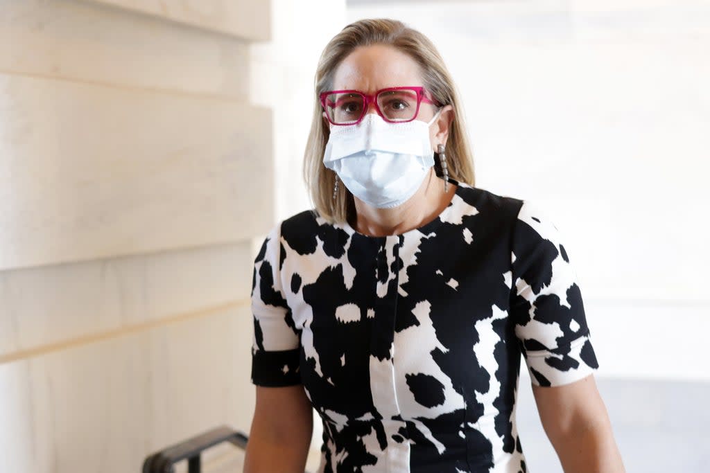 US Sen Kyrsten Sinema (D-AZ) arrives at the US Capitol for a vote 29 September 2021 in Washington DC. (Getty Images)