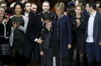 French President elect Emmanuel Macron and his wife Brigitte Trogneux celebrate on the stage at his victory rally near the Louvre in Paris, France May 7, 2017. , France May 7, 2017. REUTERS/Benoit Tessier