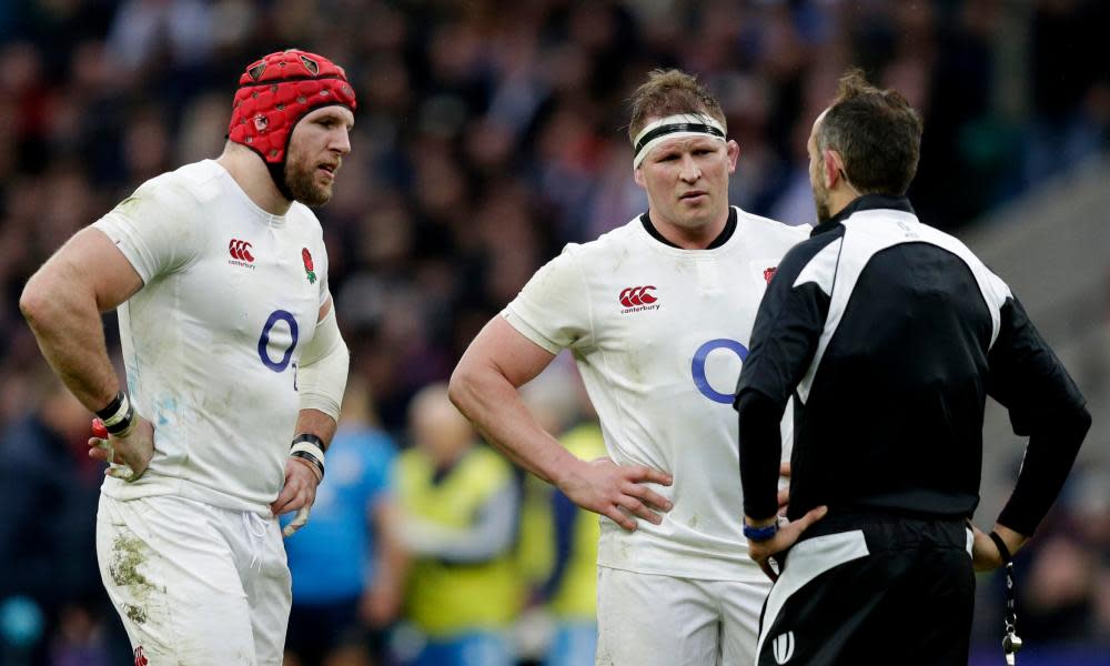 England’s James Haskell and Dylan Hartley talk to referee Romain Poite about the implications of Italy’s decision not to commit any men to the ruck after making a tackle.