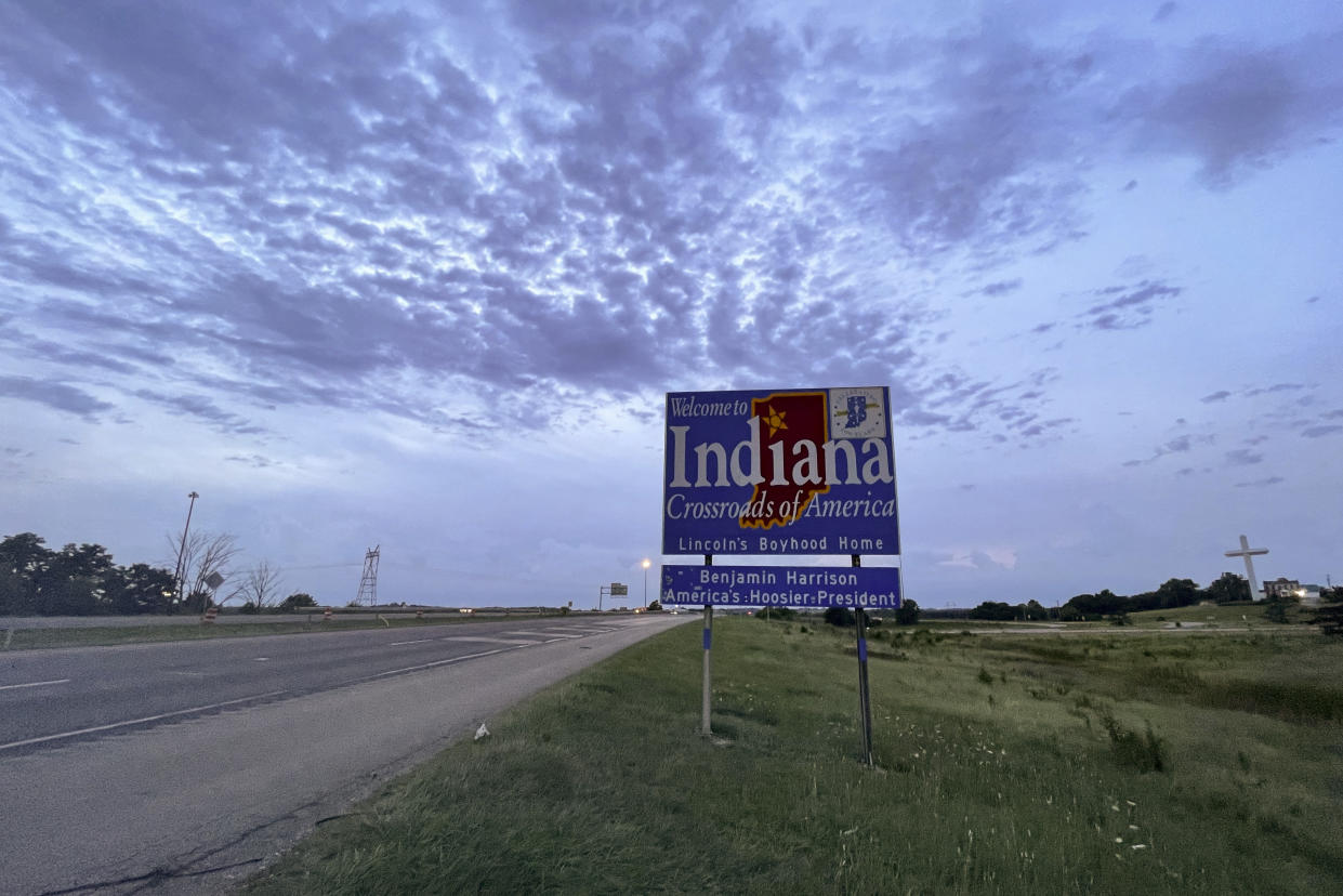 This photo from, August 3, 2022, shows a sign on Interstate 70 West in Richmond, Indiana, welcoming travelers to Indiana. Monica Eberhart traveled this route from Dayton, Ohio to Indianapolis to receive abortion care. (AP Photo/Patrick Orsagos, File)
