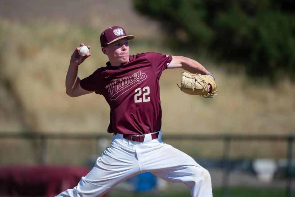 Whitney’s Jace Gillmore (22) pitches in the first inning during Game 1 of the CIF Sac-Joaquin Section Division I baseball semifinals against the St. Mary’s Rams on Monday, May 15, 2023, at Whitney High School in Rocklin. Gillmore pitched seven innings with five hits and one earned run.