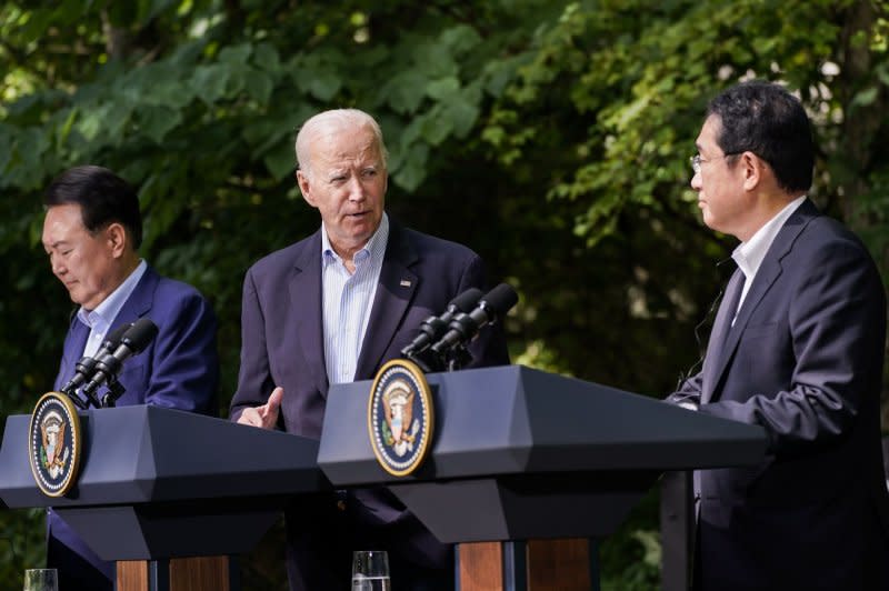 U.S. President Joe Biden (C), South Korean President Yoon Suk Yeol (L) and Japanese Prime Minister Fumio Kishida hold a joint news conference at the Trilateral Summit at Camp David in Maryland on Friday. Photo by Nathan Howard/UPI