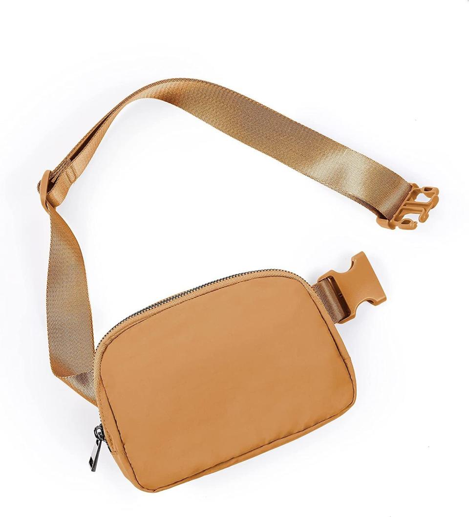 Finally, a minimalist cross-body bag that's actually in stock and comes in 39 colors. Made from water-resistant nylon with an adjustable strap measuring up to 48 inches, this budget-friendly cross-body bag will be your daily essential. It has a hidden back-zipper for your passport or extra cash and a large front pocket with a main compartment and mesh sections on the sides to organize your phone, keys, cards and other smaller items. The front clasp gives you extra security and the durable zipper is easy to open and close with one hand.You can buy the mini belt bag from Amazon for around $19. 