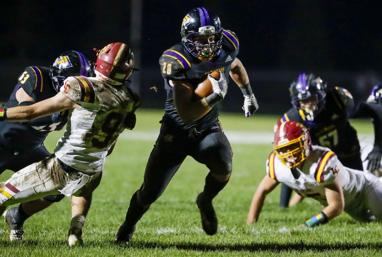 Two Rivers’ Chase Matthias (28) carries the ball against Luxemburg-Casco, Friday, November 3, 2023, in Two Rivers, Wis.