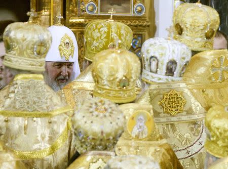 New Orthodox Patriarch Kirill (L) receives congratulations from clergy after he was crowned as the 16th Patriarch of Moscow and all Russia in Moscow's Christ the Saviour Cathedral, in this February 1, 2009 file photo. REUTERS/Sergei Karpukhin/Files