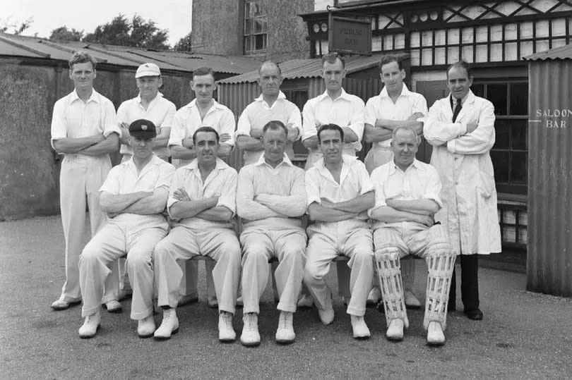 A cricket team poses outside The Cricketers public house in Meopham in Kent Circa June 1950