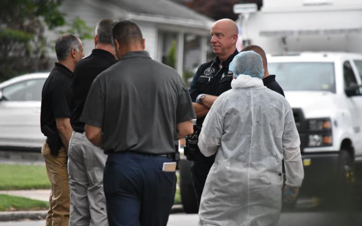 Crime scene investigators pull evidence from Rex Heuermann's home