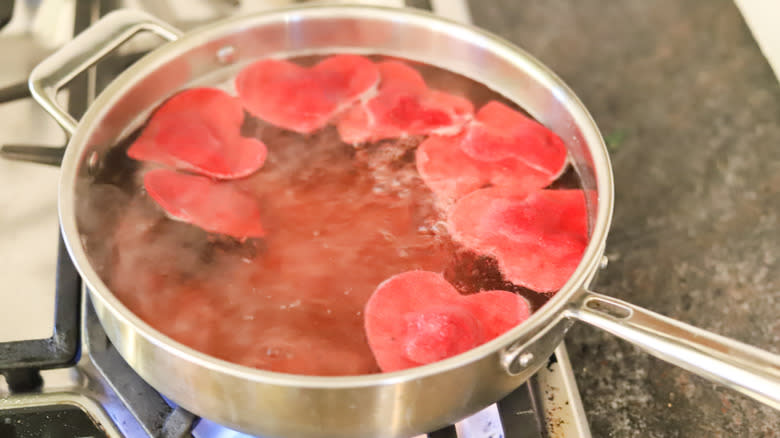 boiled beet ravioli in pan