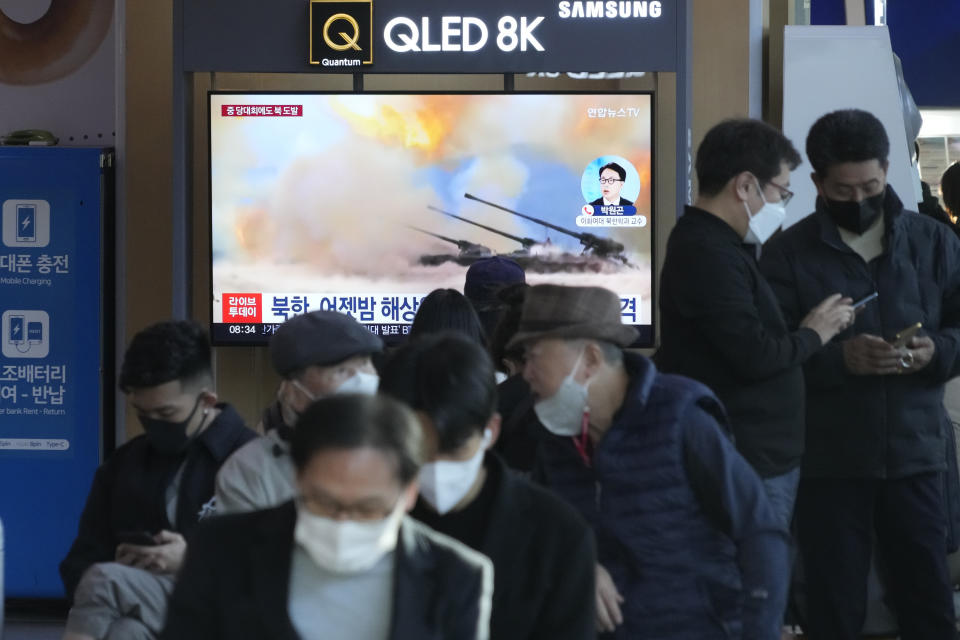 A TV screen shows a file image of North Korea's military exercise during a news program at the Seoul Railway Station in Seoul, South Korea, Wednesday, Oct. 19, 2022. North Korea fired artillery shells near its sea boundaries with South Korea late Tuesday, a day after the South began annual military drills to better deal with North Korean provocations. (AP Photo/Ahn Young-joon)