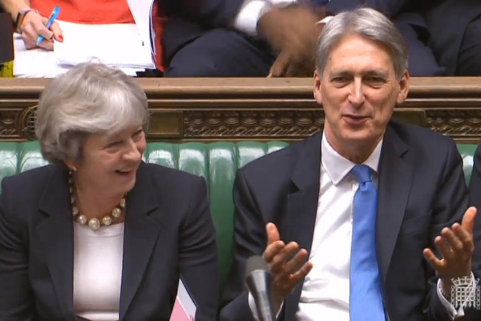 Chancellor Philip Hammond in the Commons next to the Prime Minister after delivering his speech: PA