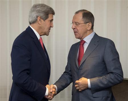 U.S. Secretary of State John Kerry (L) and Russia's Foreign Minister Sergei Lavrov shake hands during a photo opportunity prior to their meeting, in Geneva November 23, 2013. REUTERS/Carolyn Kaster/Pool