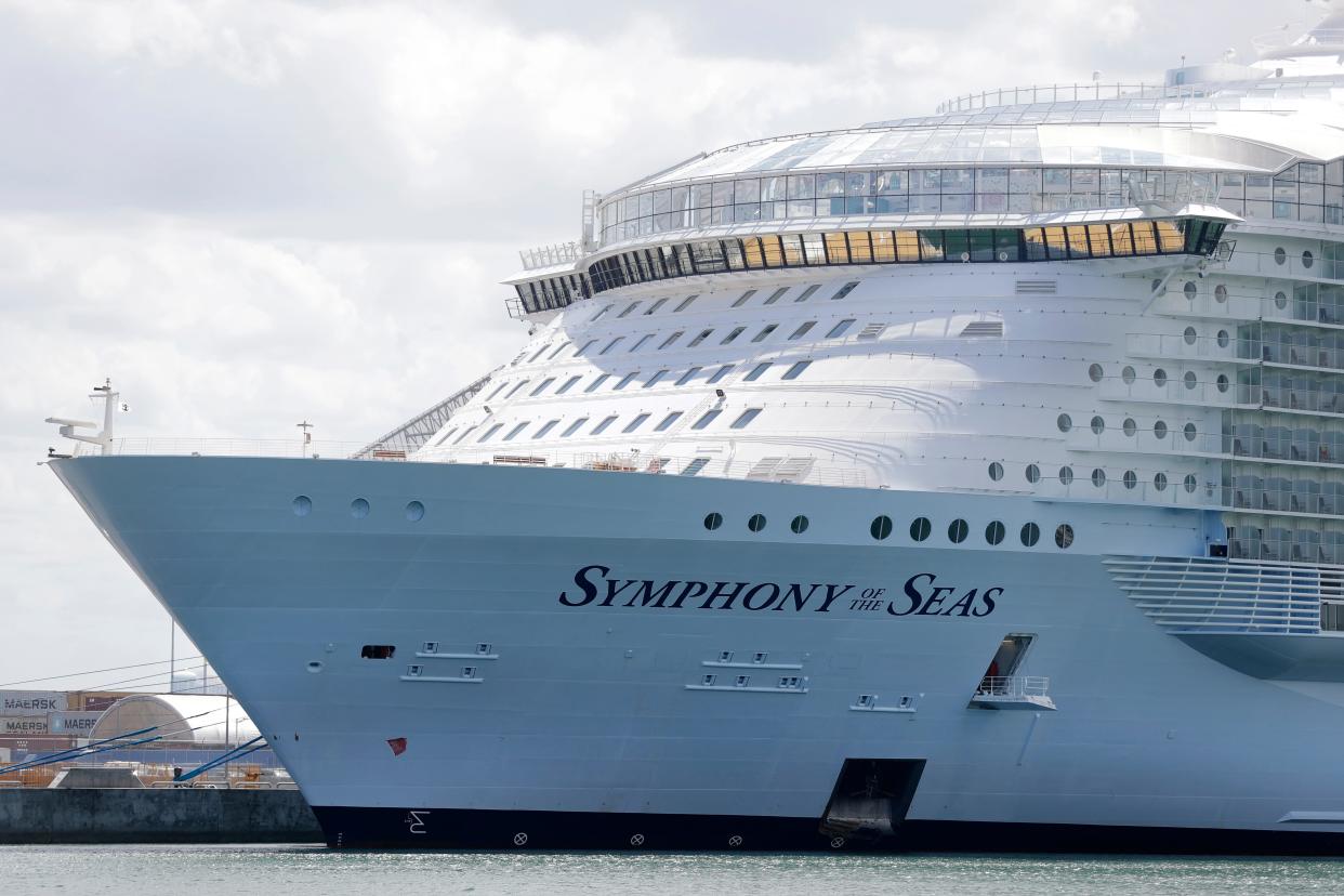 The Symphony of the Seas cruise ship is shown docked at PortMiami, in a Wednesday, May 20, 2020, file photo, in Miami.